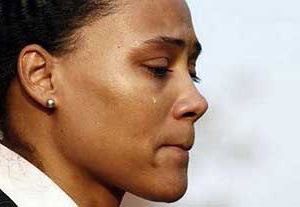Marion Jones cries as she speaks to the media after leaving the U.S. Federal Courthouse 